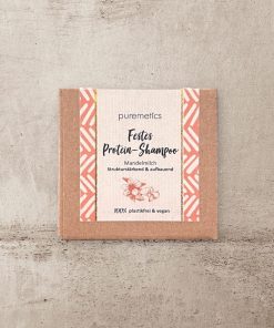 festes Shampoostück in Verpackung aus Pappe, plastikfrei, von Puremetics, Protein Mandelmilch, vegan