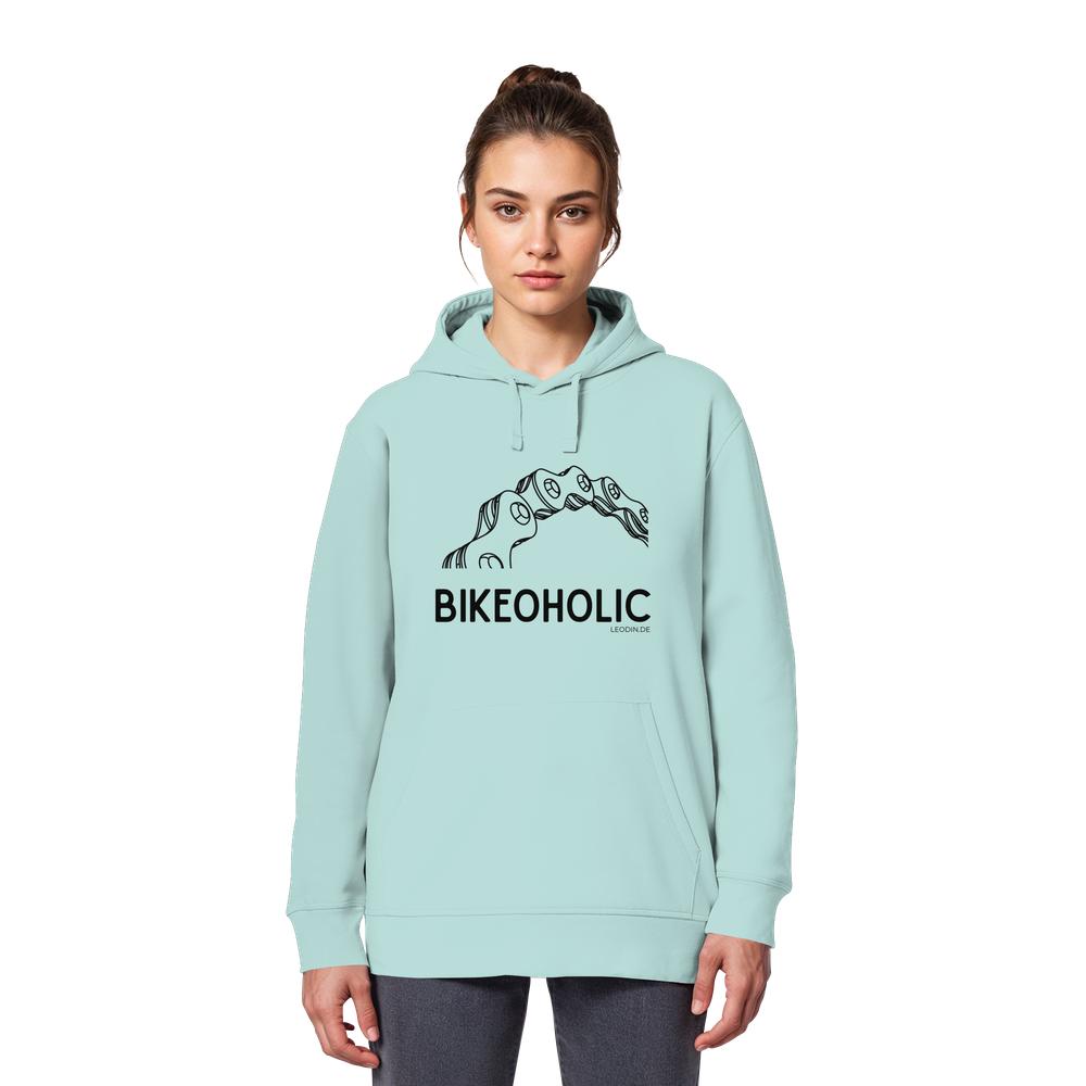 Weibliches Model trägt türkisblauen Bike Hoodie unisex mit „Bikeoholic“ Statement und Fahrradmotiv