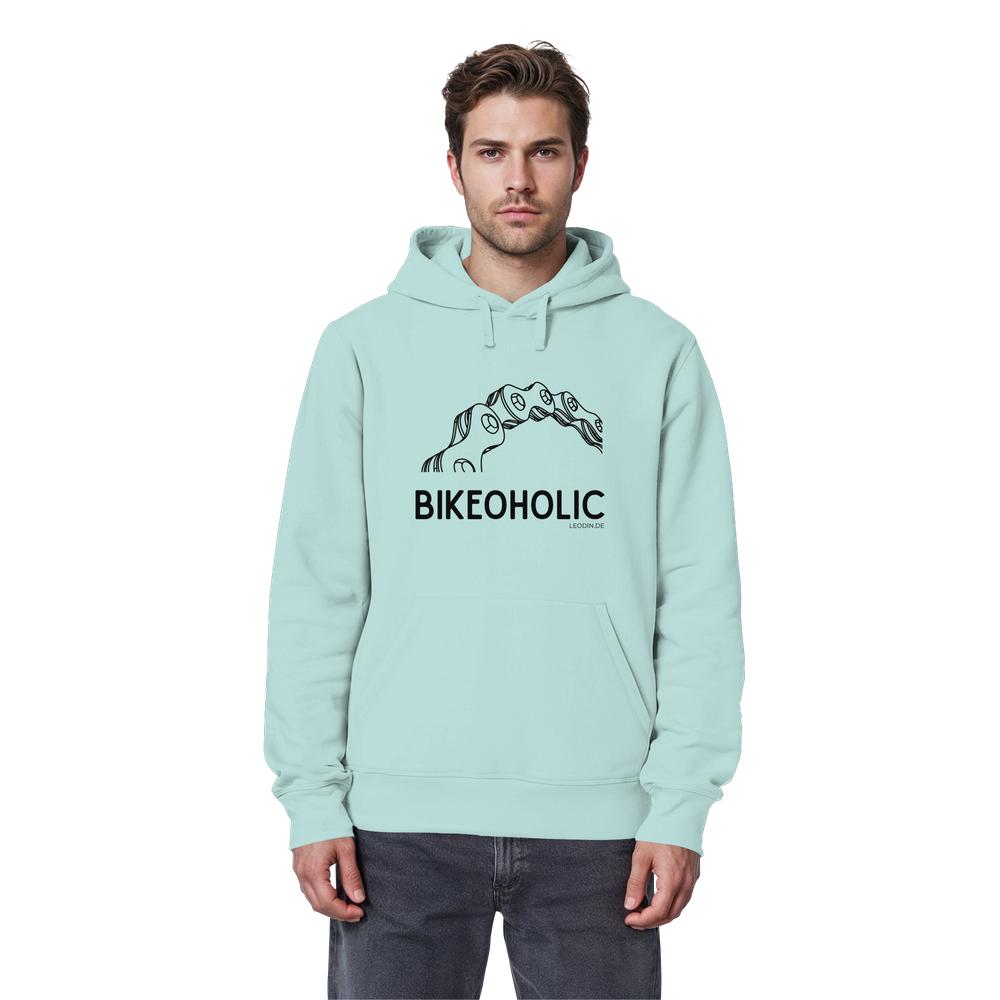 Männliches Model trägt türkisblauen Bike Hoodie unisex mit „Bikeoholic“ Statement und Fahrradmotiv